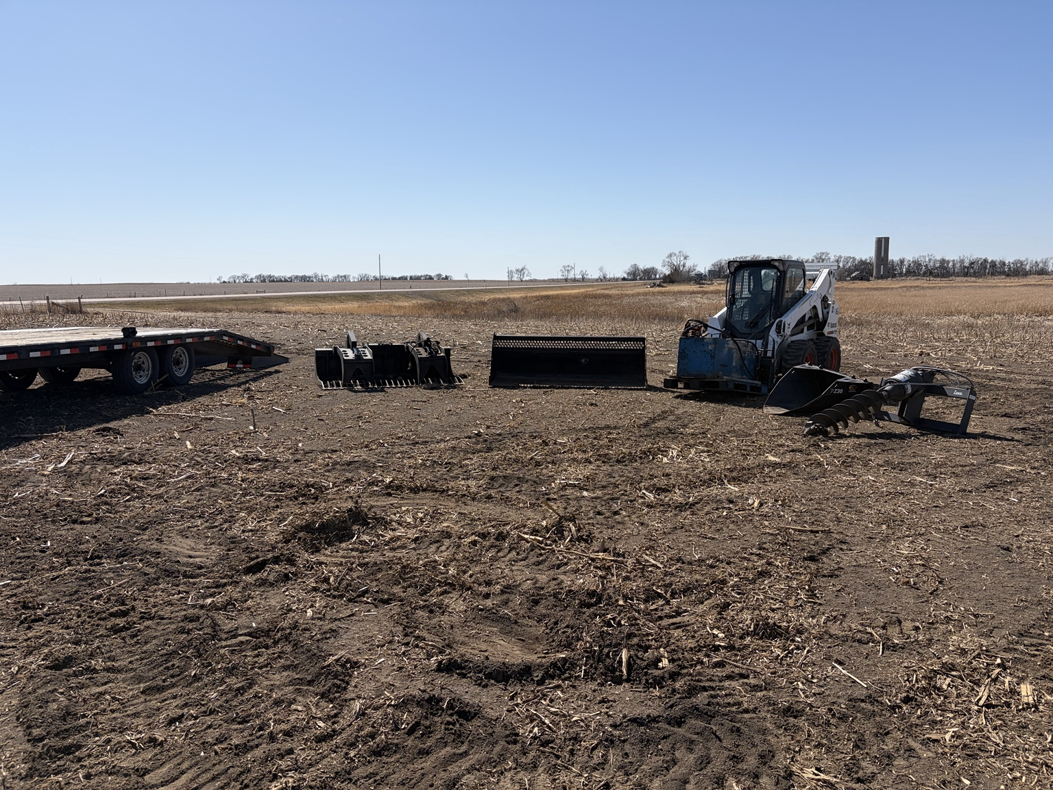 SS Stump Grinding equipment lined up at a rural southwest Minnesota job site